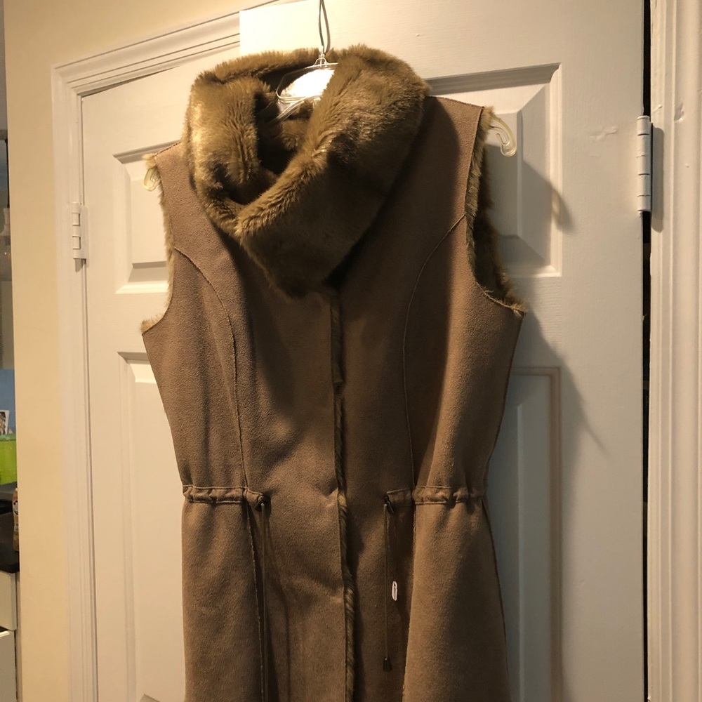 Vest small. Faux fur and suede I think.Bought at sample sale.EXCELLENTcondition